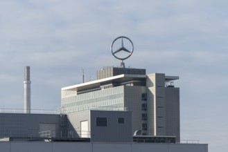 Noticeable Mercedes-Benz logo on modern industrial building against cloudy sky, Mercedes Star,