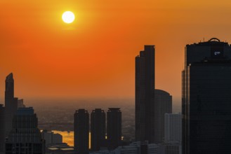 Over the rooftops of Bangkok, sunset, view from the Moon Bar on the roof terrace of the Banyan Tree