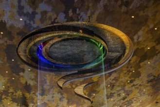 Artificial, brightly lit waterfall, Magic Waterfall, falls from the ceiling of the Iconsiam