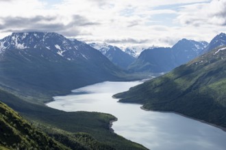 View of blue lake and mountains on Twin Peaks Trail, Eklutna Lake, Chugach Mountains, Chugach State