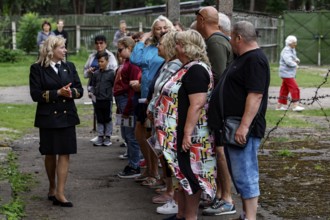 A guide explains the history of the prison in Karosta, Liepaja, Karosta, Latvia to a group