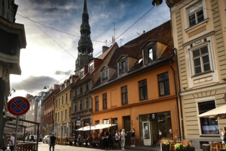 Street view with St. Peter's Church and adjacent colorful architecture in Riga, Riga, Latvia