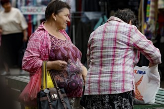 Two woman talking at Riga Central Market, Riga, Central Market, Latvia