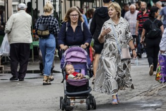 Two woman with strollers on the busy Riga Central Market, Riga, Central Market, Latvia