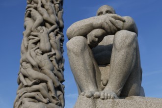 Colossal sculpture with monolith and solitary seated figure, Oslo, Norway