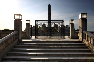 Monolith with decorative lattice gate and bright steps, Oslo, Norway