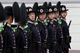 Ceremonial changing of the guard with soldiers in uniform at the Royal Palace in Oslo, Oslo,