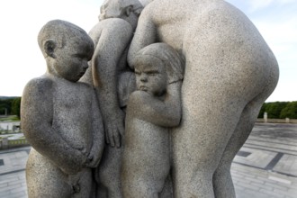 Group of granite figures with a group of children and adults in close contact, Oslo, Norway