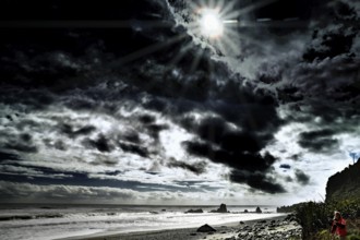 Dramatic beach with dark skies in Greymouth, New Zealand, Greymouth, West Coast, New Zealand