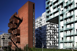 Modern new buildings in Oslo with brick and glass facades under clear blue skies, Oslo, Bydel Gamle