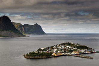 View of Husøy Island near Senja, a fishing village surrounded by mountains and sea