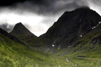 Dramatic mountain scenery under gloomy sky in Bergsbotn, Senja, Norway