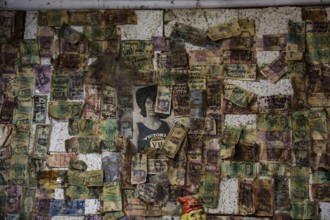 Wall of a hotel covered with notes and reminders reflecting Australian history, zero