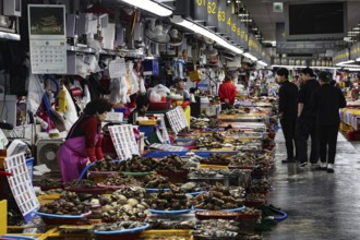 Bustling Jagalchi fish market in Busan full of people and stalls, Busan, South Korea
