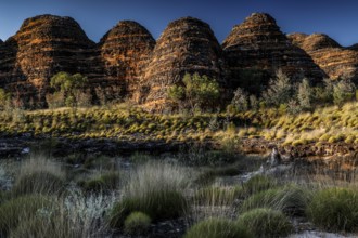 Game-shaped rock formations in an impressive landscape under a blue sky, zero