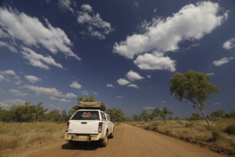 An off-road vehicle on dusty road in Purnululu National Park, Purnululu National Park, Western