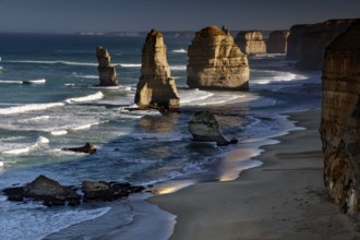 Waves meet dramatic rock formations in the ocean, peaceful coastal atmosphere, zero