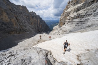 Three climbers descending the Sentiero Martinazzi, Camosci Valley, Brenta Mountains,