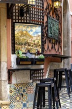 Bars, restaurants and murals on Rue da Fonte da Pipa, Sintra, Lisbon, Portugal