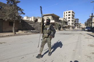 In Aleppo, Syria on January 10, 2026, Syrian Army soldiers deploy throughout the Sheikh Maqsoud and