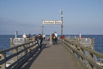 Tourists on the pier, sign Seebad Binz, Binz, seaside resort, Rügen island, Baltic Sea,