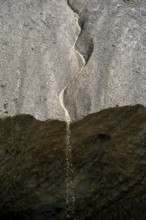 Meltwater at a glacier cave, underground glacier stream, Castner Glacier, Delta Range, Alaska