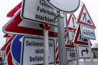 Storage for traffic signs in the yard of a road maintenance department, various signs with