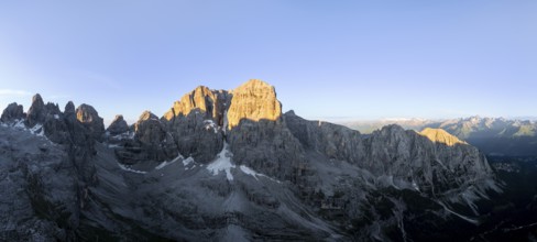 Aerial view, alpine panorama, Cima Tosa and rocky peaks at sunrise with alpine glow, picturesque