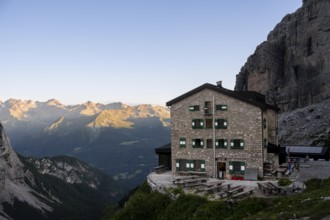 Rifugio Maria E Alberto Ai Brentai mountain hut and rocky peak, Brenta, Trentino, Italy