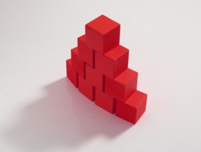 10 red wooden cubes against a white background