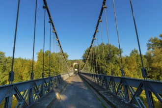 Suspension bridge of Coudes village on river Allier. Puy de Dome. Auvergne Rhone Alpes. France