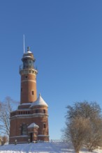 Holtenau lighthouse at the entrance of the Kiel Canal in winter, west bank of the Kiel Fjord,