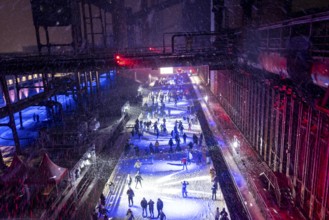 Ice rink at the Zollverein coking plant, ice skating with music and many lighting effects, Essen,
