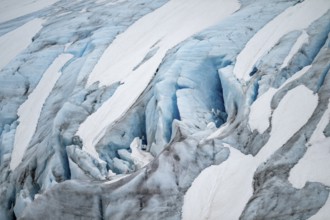 Blue rugged glacier ice with crevasses and snow, detail, Exit Glacier, Kenai Peninsula, Alaska, USA
