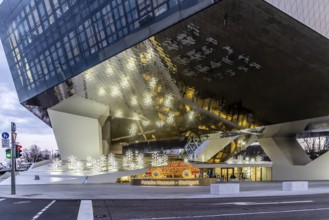 Highlights on Porscheplatz in Zuffenhausen. In front of the Porsche Museum and the car