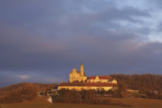 Benedictine monastery with late baroque monastery church, lighting atmosphere, winter, Neresheim,