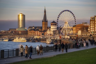 Rhine promenade in Düsseldorf, Ferris wheel, old castle tower, St. Lambert Basilica, old town, ERGO