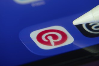 16 Nov 2025- Dhaka, Bangladesh: Stylus touching the Pinterest app icon on a smartphone screen