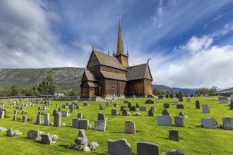 Lom Stave Church (Lom stavkyrkje) with cemetery in the foreground, Lom, Norway