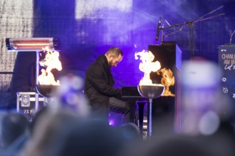Igor Levit (pianist) plays the piano at the lighting of the 20th anniversary Hanukkah in front of