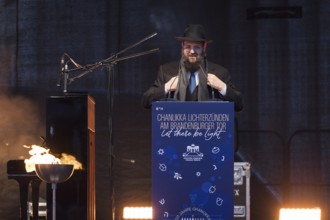 Yehuda Teichtal (Rabbi of the Chabad-Lubavitch movement) speaks at the lighting of lights to mark