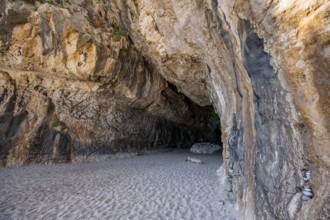 Rock cave on the beach at Cala Luna, Golfo di Orosei, Baunei, Sardinia, Italy
