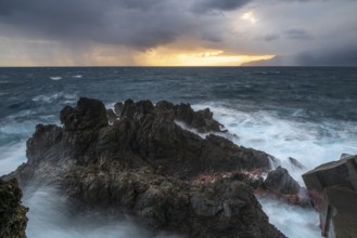 Sunrise, waves and rocks, coast near Porto Moniz, Madeira, Portugal