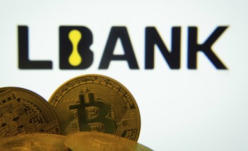 Dhaka, Bangladesh- 03 Sep 2025: Close-up of Bitcoin coins with the LBank logo visible on a screen