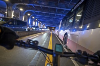 Cycling in the city, in the dark, in the evening, cycling underpass at the main train station, in
