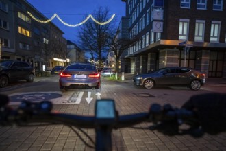 Cycling in the city, in the dark, in the evening, inner-city road, bicycle road, two-wheeler