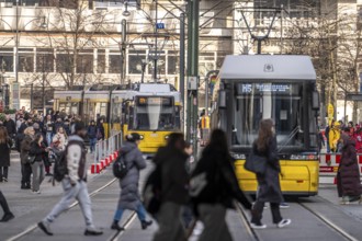 Trams at Alexanderplatz in Berlin, passers-by, Germany