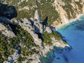 Picturesque rocky coast, cliffs with L'Aguglia pinnacle, blue sea and Cala Goloritzé beach, aerial