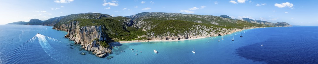 Picturesque rocky coast, cliffs and Cala Luna beach, aerial view, Golfo di Orosei, Baunei,