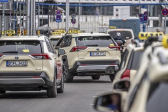 Taxis in front of the main train station in Berlin, waiting in line for passengers, Germany